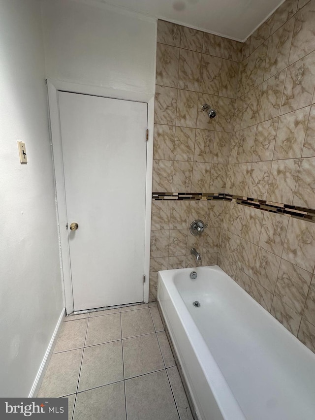 full bath featuring baseboards, shower / washtub combination, and tile patterned flooring