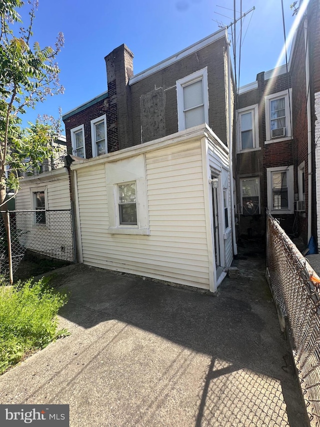 back of property with fence