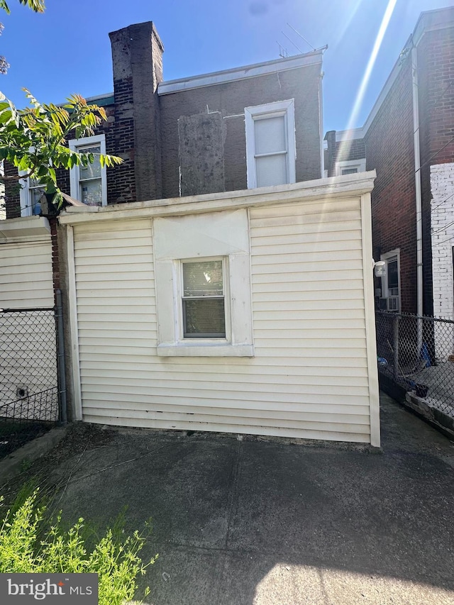 view of property exterior featuring fence
