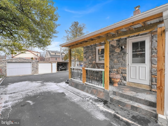 exterior space with stone siding and a chimney