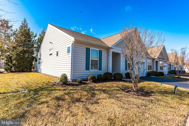 view of front of house featuring a front yard and driveway