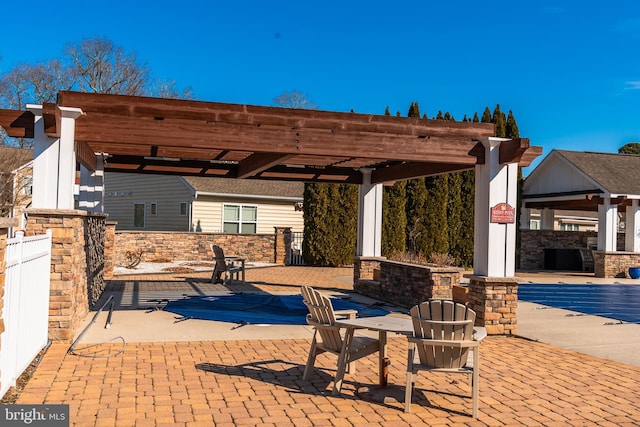 view of patio with fence and a pergola