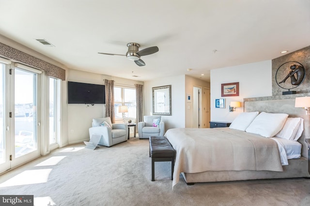 bedroom featuring access to exterior, visible vents, carpet flooring, ceiling fan, and baseboards