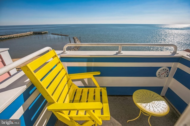 balcony featuring a water view