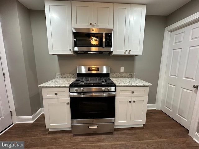 kitchen with white cabinetry and appliances with stainless steel finishes