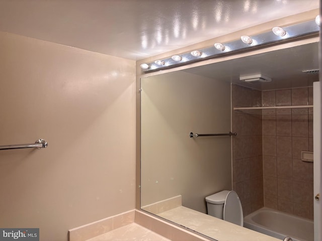 full bathroom with shower / bath combination and toilet