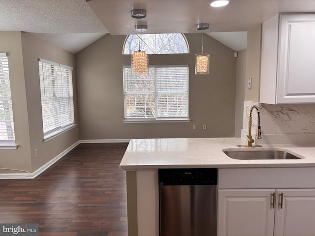 kitchen featuring a sink, white cabinetry, light countertops, dishwasher, and pendant lighting