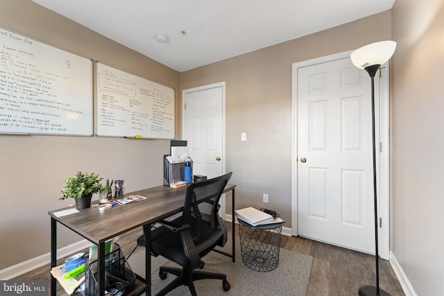 office area with baseboards and dark wood-style flooring