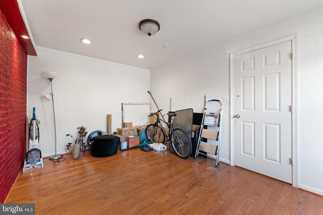 misc room featuring crown molding, recessed lighting, and wood finished floors