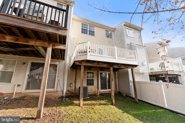 rear view of house with fence