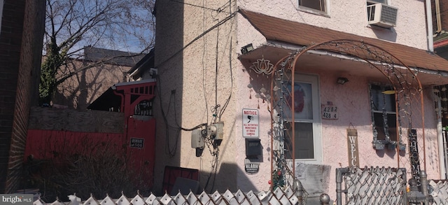 view of side of property featuring stucco siding