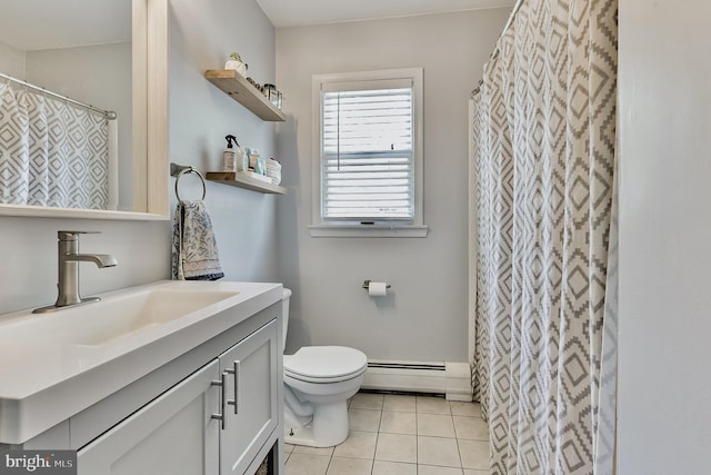 bathroom with a baseboard heating unit, vanity, toilet, and tile patterned floors