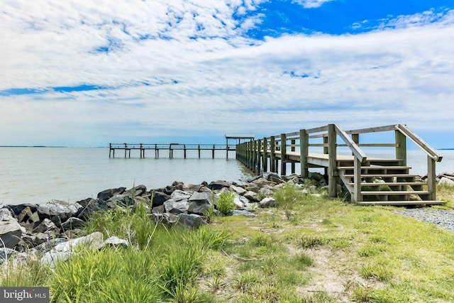 dock area with a water view