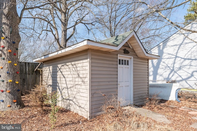 view of shed with fence