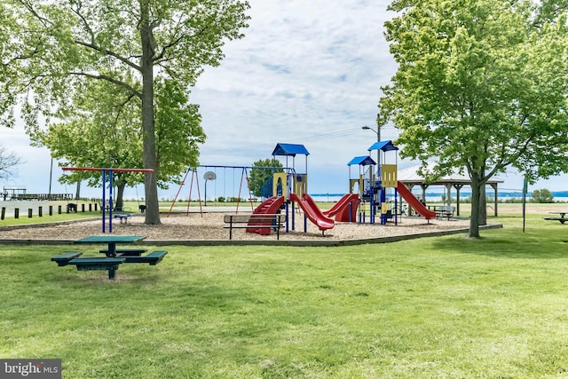 community playground featuring a lawn