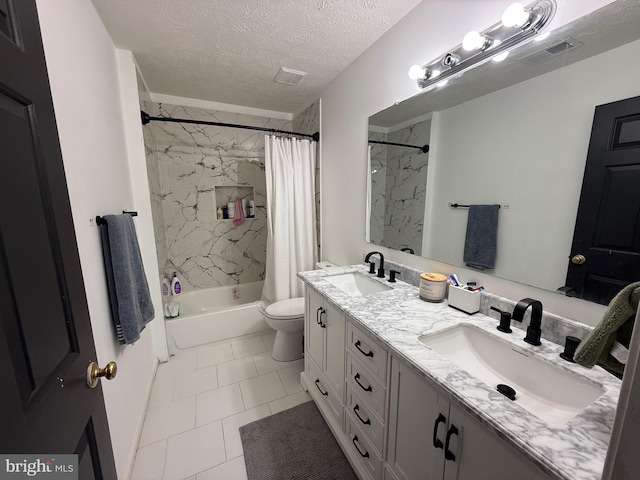 bathroom with visible vents, a sink, a textured ceiling, and shower / bath combo with shower curtain