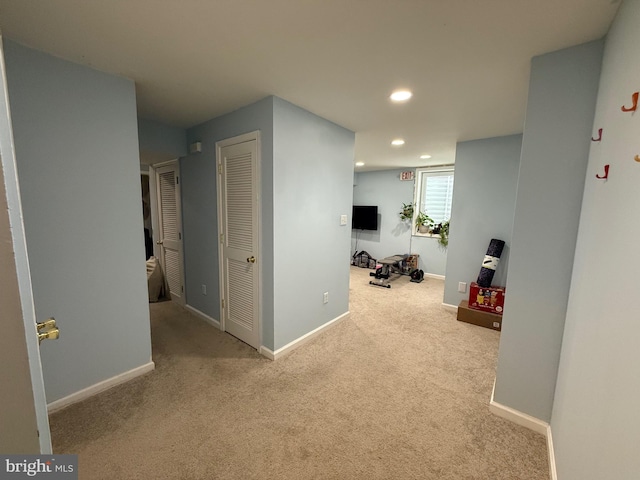 hall featuring baseboards, carpet flooring, and recessed lighting