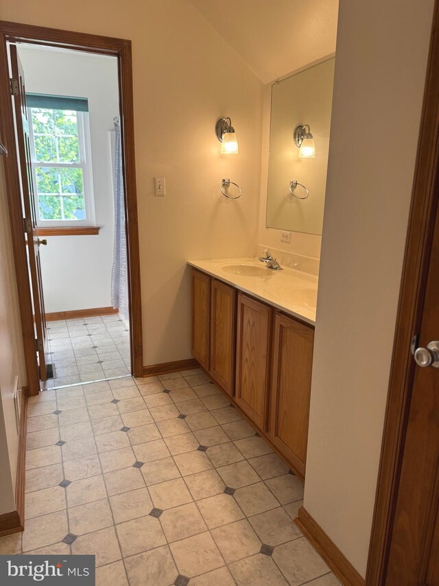 200 Stewards Ct, Bear, DE 19701 - full bath featuring vaulted ceiling, tile patterned flooring, double vanity, and baseboards