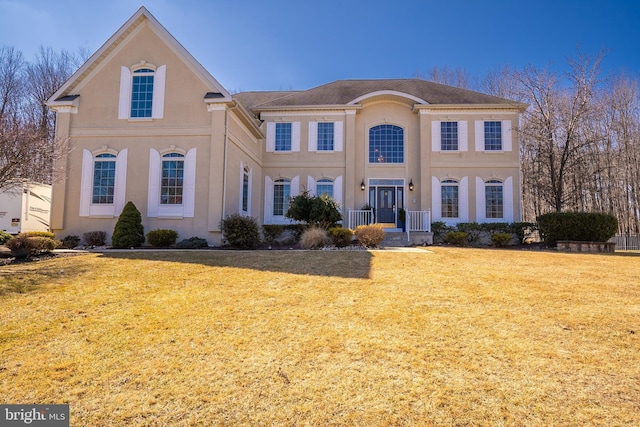 view of front of property featuring a front yard and stucco siding