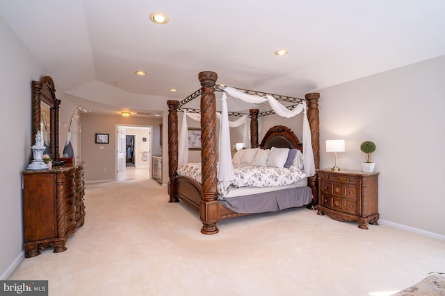 bedroom featuring recessed lighting, light colored carpet, and baseboards