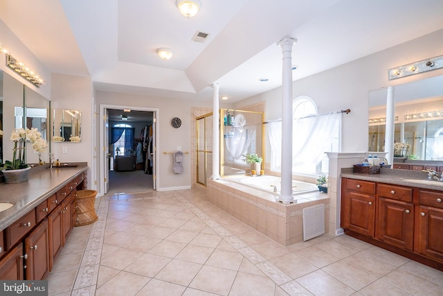 full bathroom featuring visible vents, a stall shower, tile patterned flooring, and decorative columns