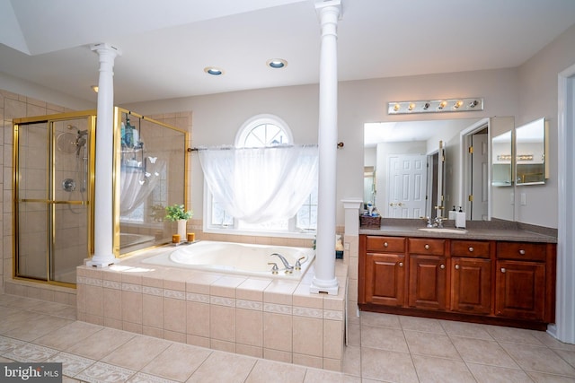 full bath with a bath, a stall shower, tile patterned flooring, and decorative columns