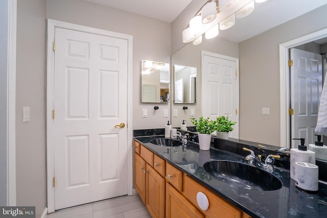 bathroom with double vanity and a sink