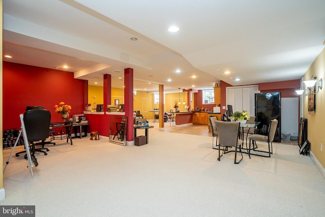 interior space with recessed lighting, baseboards, light colored carpet, and a bar