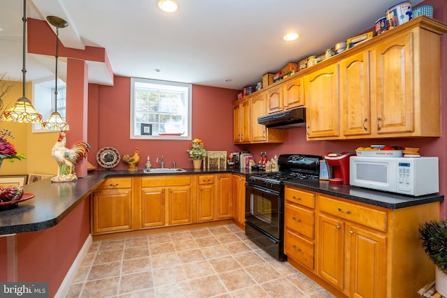 kitchen with brown cabinets, white microwave, black range with gas stovetop, a peninsula, and under cabinet range hood