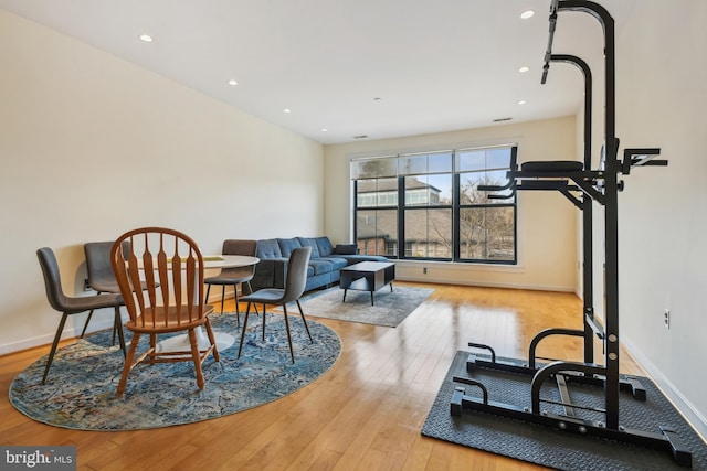 interior space featuring recessed lighting, light wood-type flooring, and baseboards