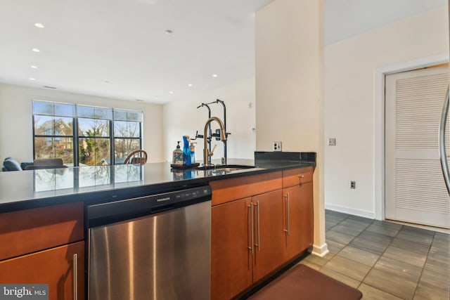 kitchen featuring dark countertops, recessed lighting, a sink, tile patterned flooring, and dishwasher