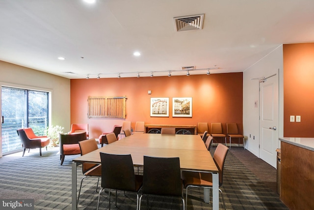 dining space featuring visible vents, dark carpet, and recessed lighting