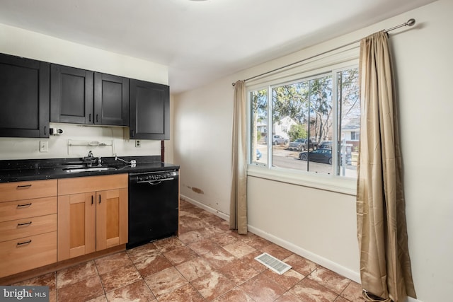 kitchen featuring baseboards, visible vents, dishwasher, dark countertops, and a sink