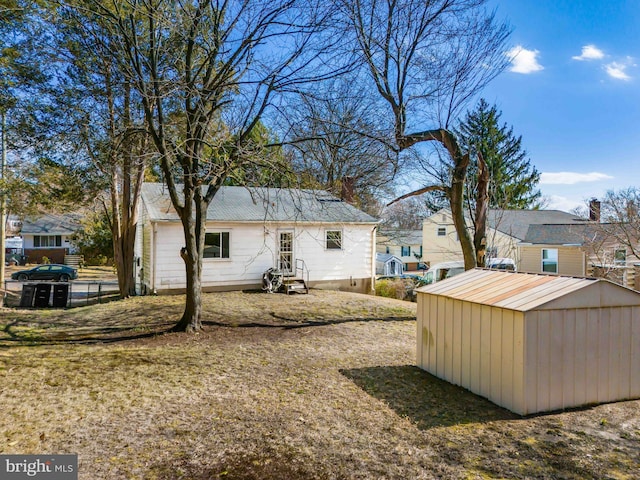 view of yard with an outbuilding and a shed