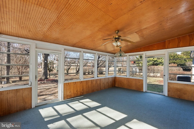 unfurnished sunroom with wood ceiling, vaulted ceiling, and a ceiling fan