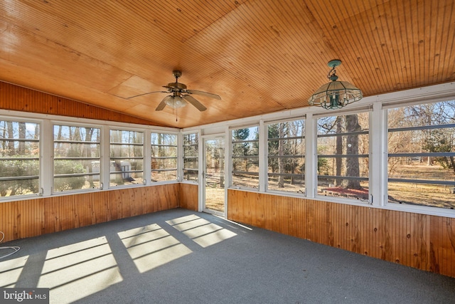 unfurnished sunroom with vaulted ceiling, ceiling fan, and wood ceiling