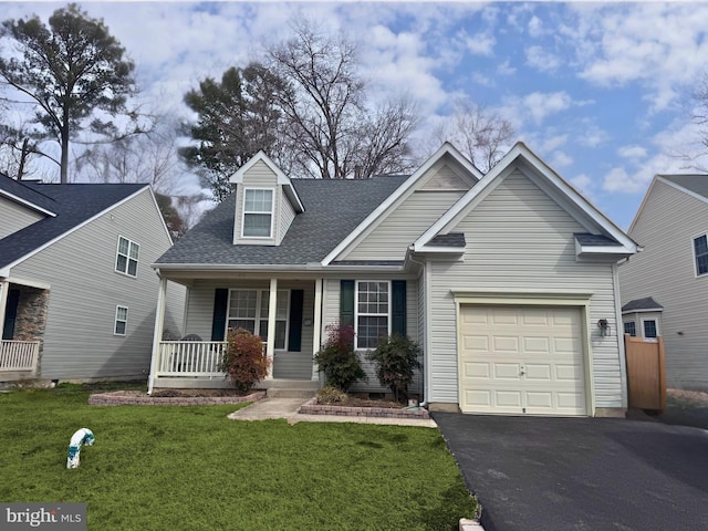 view of front of house with roof with shingles, a porch, a garage, driveway, and a front lawn