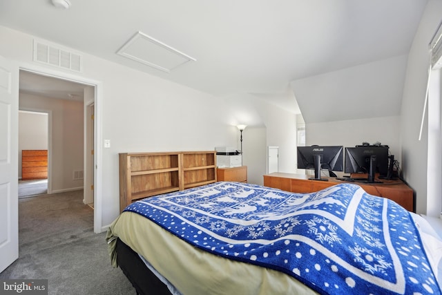 bedroom featuring carpet floors, lofted ceiling, visible vents, attic access, and baseboards