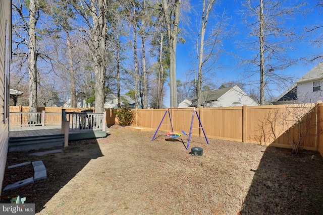 view of yard featuring a deck and a fenced backyard