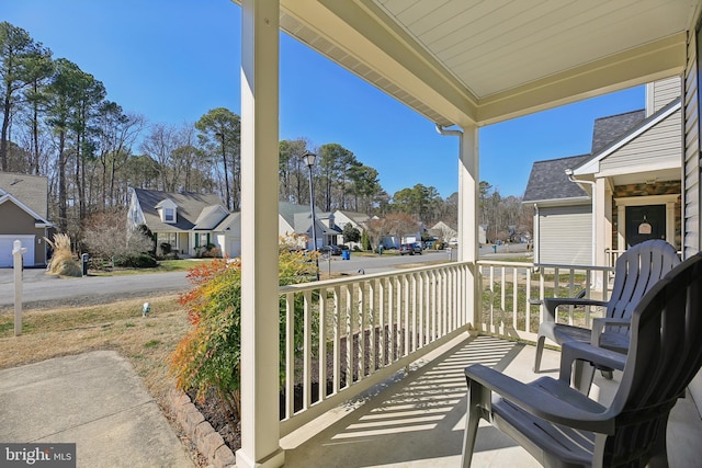 balcony featuring a residential view and a porch