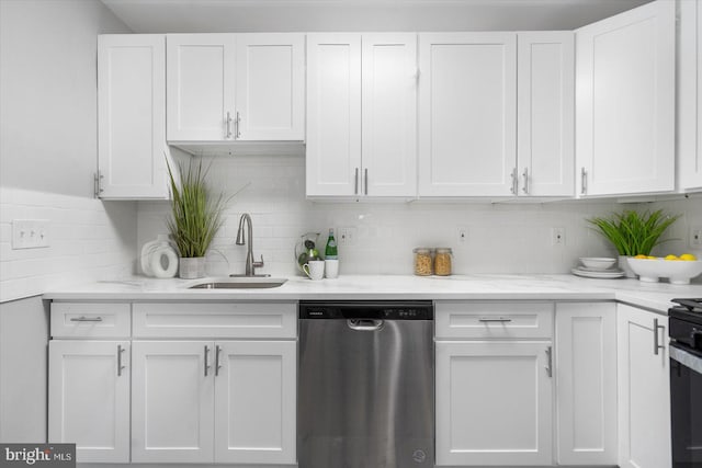 kitchen with dishwasher, light stone counters, backsplash, white cabinetry, and a sink