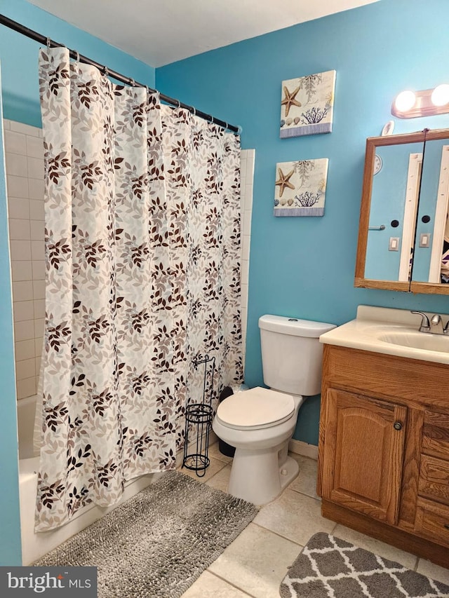 2433 Yarmouth Ct, Waldorf, MD 20602 - bathroom featuring shower / bath combo, baseboards, toilet, vanity, and tile patterned flooring