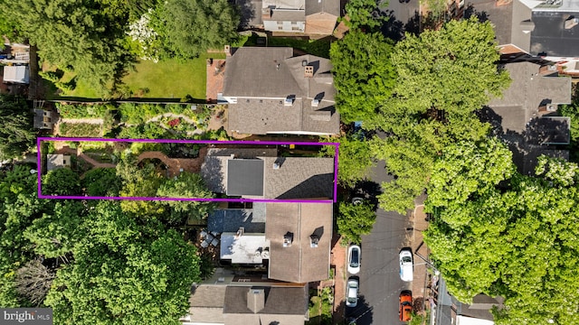 birds eye view of property with a residential view