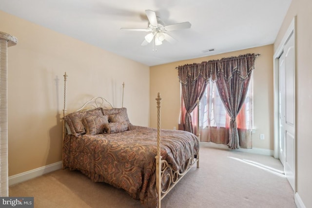 bedroom featuring a ceiling fan, carpet, visible vents, and baseboards