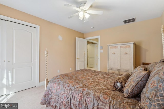 bedroom with light colored carpet, visible vents, and ceiling fan