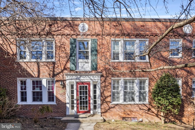 townhome / multi-family property featuring brick siding