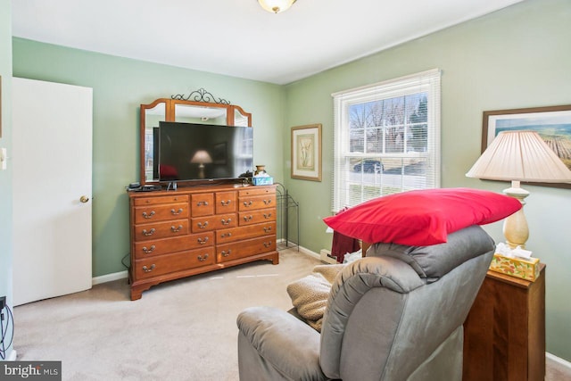 carpeted living room with baseboards