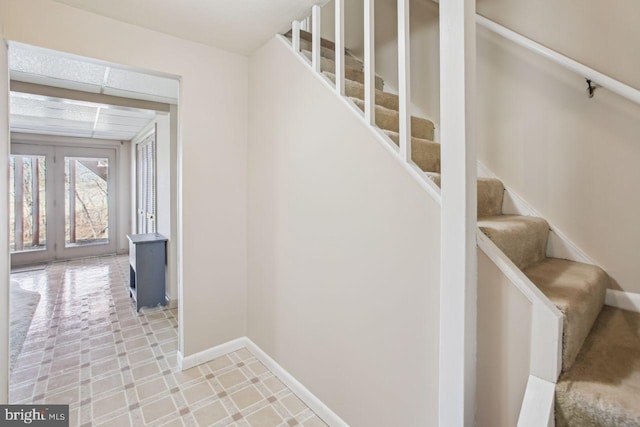 stairway with baseboards