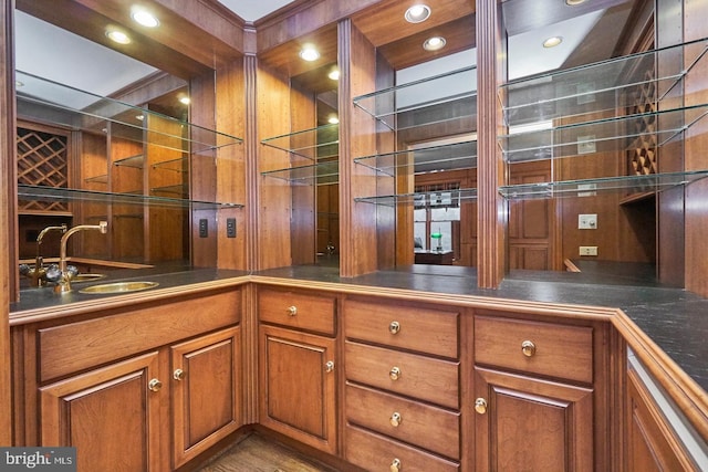 interior space with a sink, wet bar, and recessed lighting