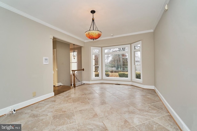 empty room with light tile patterned floors, crown molding, and baseboards